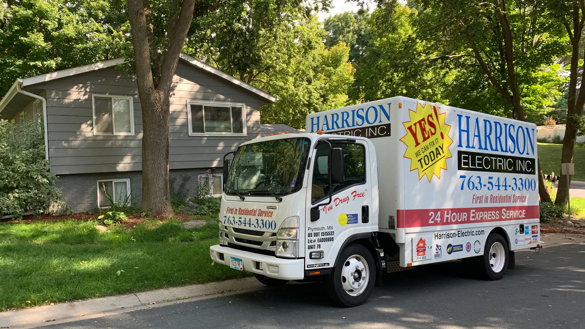 Harrison Electric service truck parked in front of a Twin Cities home