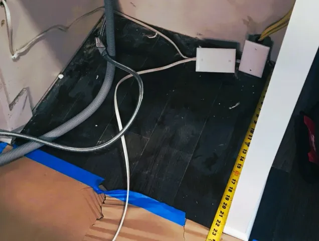 Improper, hazardous wiring found under a kitchen dishwasher cabinet