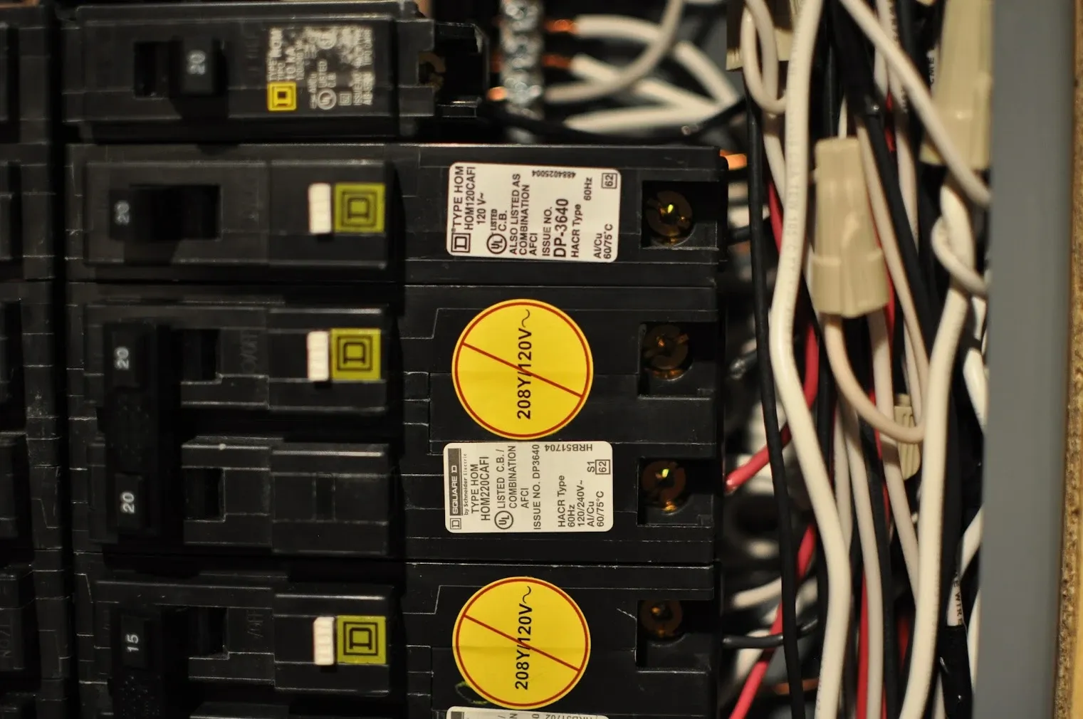 Close-up of Square D circuit breakers and wiring in a residential panel