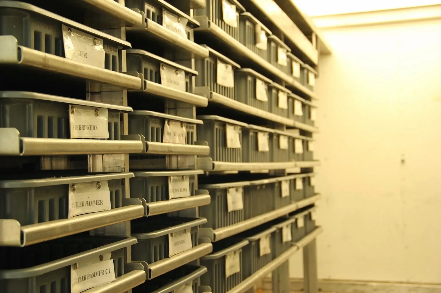 Inside a Harrison Electric Warehouse on Wheels truck, with shelves of labeled parts bins